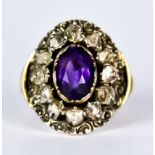An Amethyst and Diamond Ring, Antique, yellow metal set with a centre faceted amethyst,