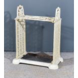 A Victorian White Painted Cast Iron Rectangular Two-Handled Stick/Umbrella Stand, the top with two