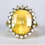 A Sapphire and Diamond Ring, 20th Century, 15ct gold set with a centre yellow sapphire,