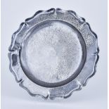 A Silvery Metal Circular Dish, stamped 900 standard, with shaped rim and planished finish, the