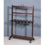 A 19th Century Mahogany Boot Rack, on square uprights and scroll feet, 26ins wide x 12.5ins deep x