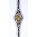 A Lady's Farsi Manual Wind Cocktail Wristwatch, 18ct gold case set with approximately 8ct of