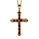 A Seed Pearl and Amethyst Set Cross, suspended from a 9ct gold rope chain, the silver gilt cross set