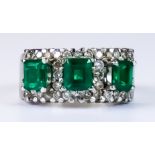 An Emerald and Diamond Ring, Modern, 18ct gold set with three empress cut emeralds, each
