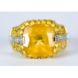 A Citrine and Diamond Ring, 20th Century, 14ct gold set with a central faceted citrine stone,