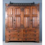 A 19th Century Panelled Oak and Wrought Iron Hall Cupboard, of Gothic form, with carved quatrefoil