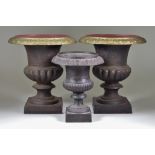 A Pair of Cast Iron Campagna-Shaped Urns, 9.5ins diameter x 10ins high, and one other, 7ins diameter