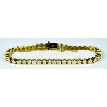 A Diamond Tennis Bracelet, Modern, yellow metal set with brilliant cut white diamonds