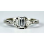 A Baguette Diamond Ring, 20th Century, platinum set with a centre baguette diamond, approximately .