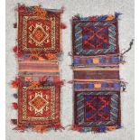 Two Antique Turkman Saddlebags, woven in colours, with geometric motifs on wine ground, 40ins x
