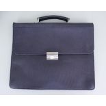 A Silver Carbon Leather Briefcase by Simpson of London, 16ins x 13ins, embossed with maker's name