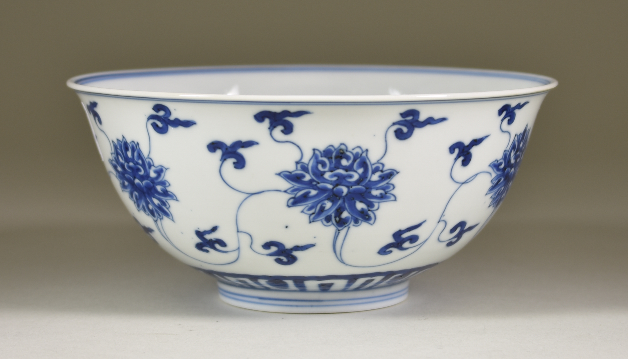 A Chinese Kangxi Blue and White Porcelain Circular Bowl, painted with lotus flowers, 6.5ins (16.5cm) - Image 3 of 8