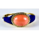 A Coral, Diamond and Enamel Stiff Bracelet, Modern, 18ct gold set with a centre cabochon coral, 20mm
