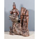 A Chinese Carved Rootwood Figure of Guan Yin With Praying Attendant, 19th Century, with applied
