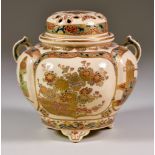 A Japanese Satsuma Pottery Censer and Pierced Cover, Meiji, of lobed form, enamelled and gilt with