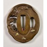 A Japanese Bronze Tsuba, 19th Century, inlaid with three gold chidori (plovers), flying above