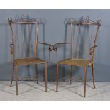 A Pair of Iron Garden Armchairs, with shaped back, outscrolled arms and mesh panels to seats, on