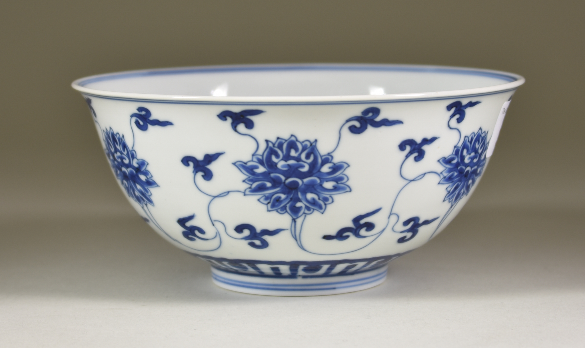 A Chinese Kangxi Blue and White Porcelain Circular Bowl, painted with lotus flowers, 6.5ins (16.5cm) - Image 6 of 8