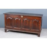 An 18th Century Panelled Oak Coffer, with moulded edge to top, four shaped fielded panels to