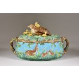 A George Jones Majolica Game Pie Dish and Cover, Circa 1873, of oval form moulded with a frieze of