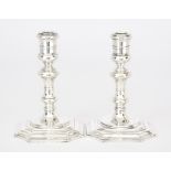 A Pair of Elizabeth II Cast Silver Pillar Candlesticks of '18th Century' Design by William Comyns,