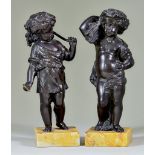 19th Century Continental School - Pair of brown patinated bronze standing figures of putti