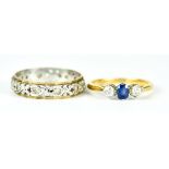 A Sapphire and Diamond Three Stone Ring, Modern, 18ct gold, set with a centre sapphire,