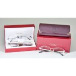 Three Pairs of Prescription Glasses by Cartier of Paris, two pairs in original boxes