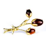 A Polished Agate Floral Brooch, 20th Century, yellow metal set with three polished cabochon agate