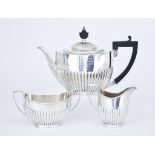 A George V Silver Oval Three Piece Tea Service, by The Goldsmiths and Silversmiths Co. Ltd, London