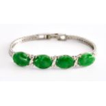 An 18ct White Gold Four Stone Jade Set Bracelet, Modern, set with four cabochon jade stones, 150mm