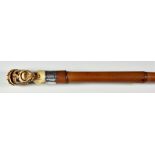 A Bone and Bamboo Novelty Walking Cane, the handle carved as the head of a monkey jockey, with