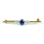 A Sapphire and Diamond Bar Brooch, yellow metal, set with a centre sapphire stone, approximately .