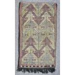 A 20th Century Anatolian Juval woven in neutral colours, the field filled with stylised floral and