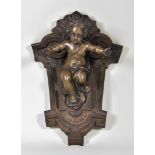 A Cast Bronze and Iron Applique, 1873, the bronze modelled as a child with outstretched arms on a
