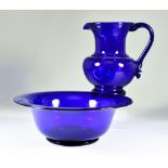 A Bristol Blue Glass Jug and Matching Basin, the jug with string moulding to under-rim and raspberry