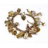 A 9ct Gold Charm Bracelet, Modern, with twenty six charms and padlock heart clasp, total gross