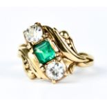 A Three Stone Emerald and Diamond Ring, 14ct gold, set with a centre emerald, approximately .30ct,