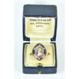 An Enamel Portrait Ring, Georgian, 14ct gold, with an oval panel depicting an enamelled portrait