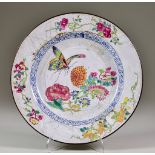 An 18th Century Chinese Enamel Plate, Circa 1730, decorated with butterfly and flowering branches,