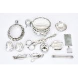 A Pair of George III Silver Sugar Nips and Mixed Silver Ware, the sugar nips by Ebenezer Coker -
