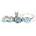 A Blue Topaz Suite, Modern, 9ct white gold ring set with a centre faceted blue topaz stone,