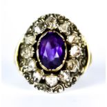 An Amethyst and Diamond Ring, Antique, yellow metal set with a centre faceted amethyst,