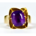 An Amethyst Dress Ring, Modern, yellow metal set with a centre faceted amethyst stone, approximately