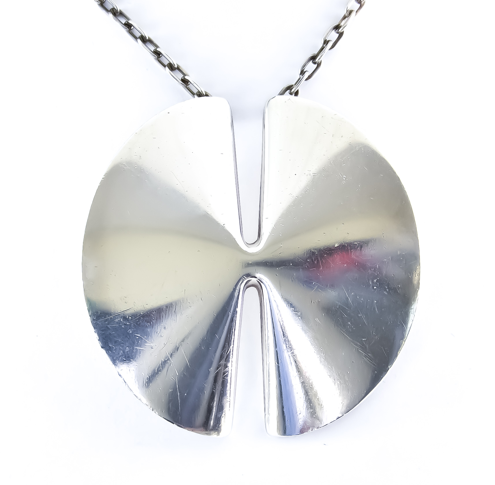 A Silver Pendant and Chain, by Georg Jensen, designed by Nana Ditzel, 660mm overall, in original