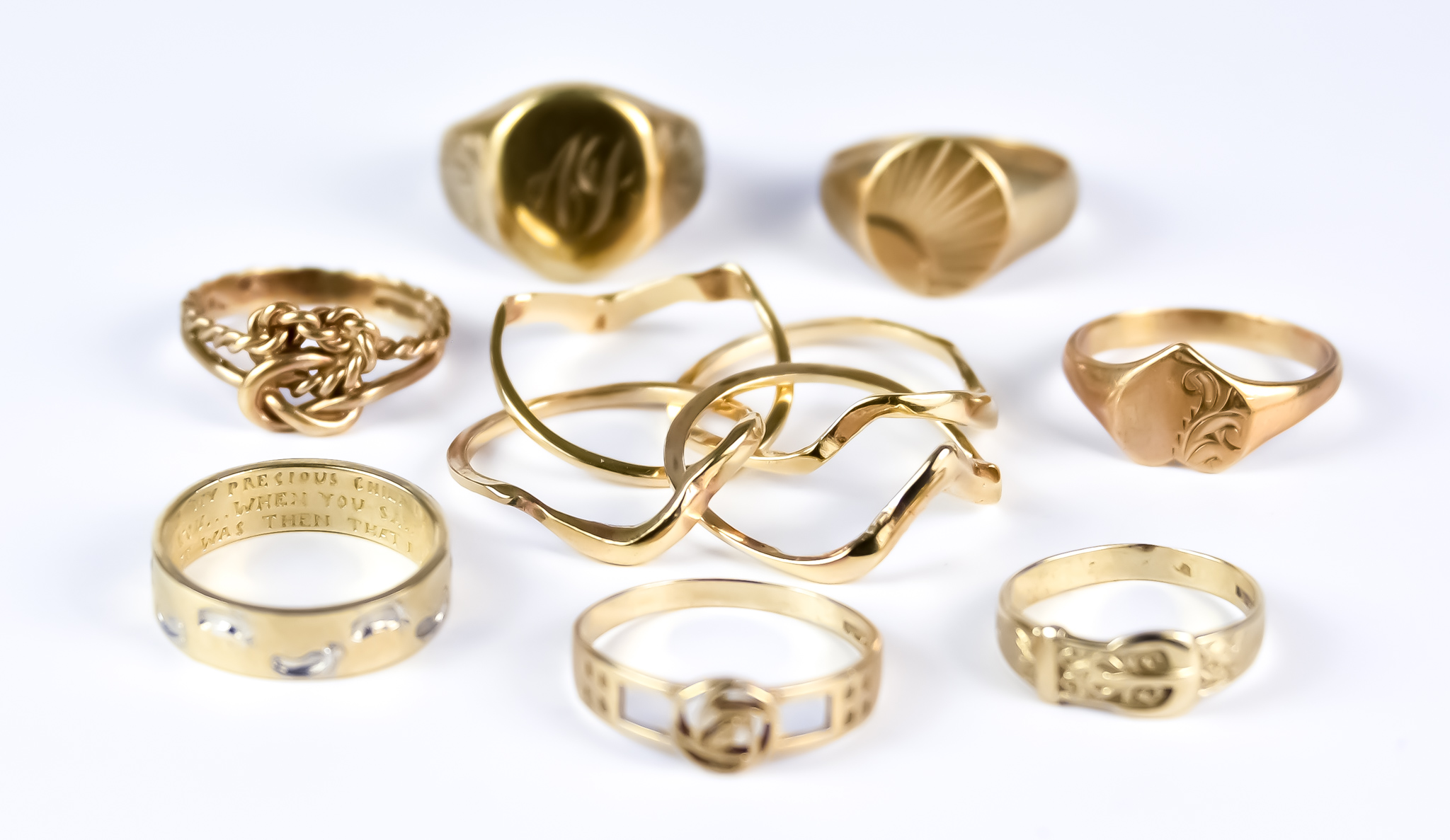 A Mixed Lot of 9ct Gold Rings, Modern, comprising - one puzzle ring, size L, one gentleman's