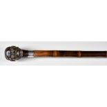 A Stained Bone, Horn and Bamboo Novelty Walking Cane, with silver ferrule, London 1880, the handle