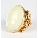 A Large Opal Dress Ring, 20th Century, 9ct gold, set with a centre opal stone 24mm x 16mm, size