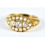 A Three Stone Diamond and Seed Pearl Ring, 20th Century, 18ct gold, set with three small brilliant