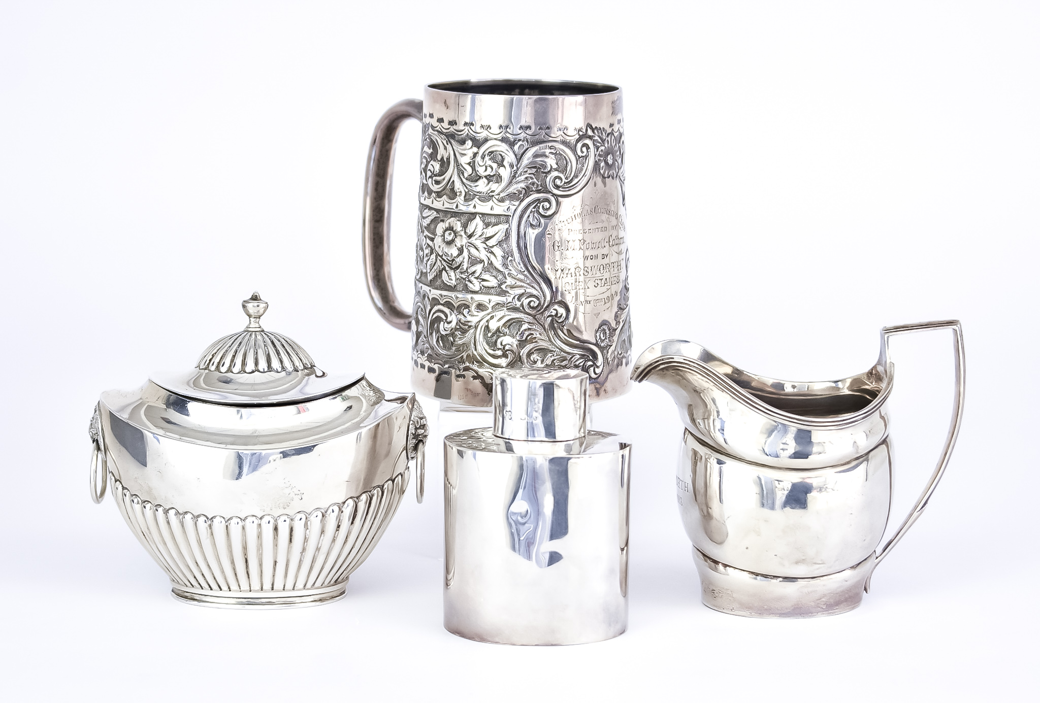 A Late Victorian Silver Embossed Tankard by William Henry Leather, Birmingham 1899, with shaped